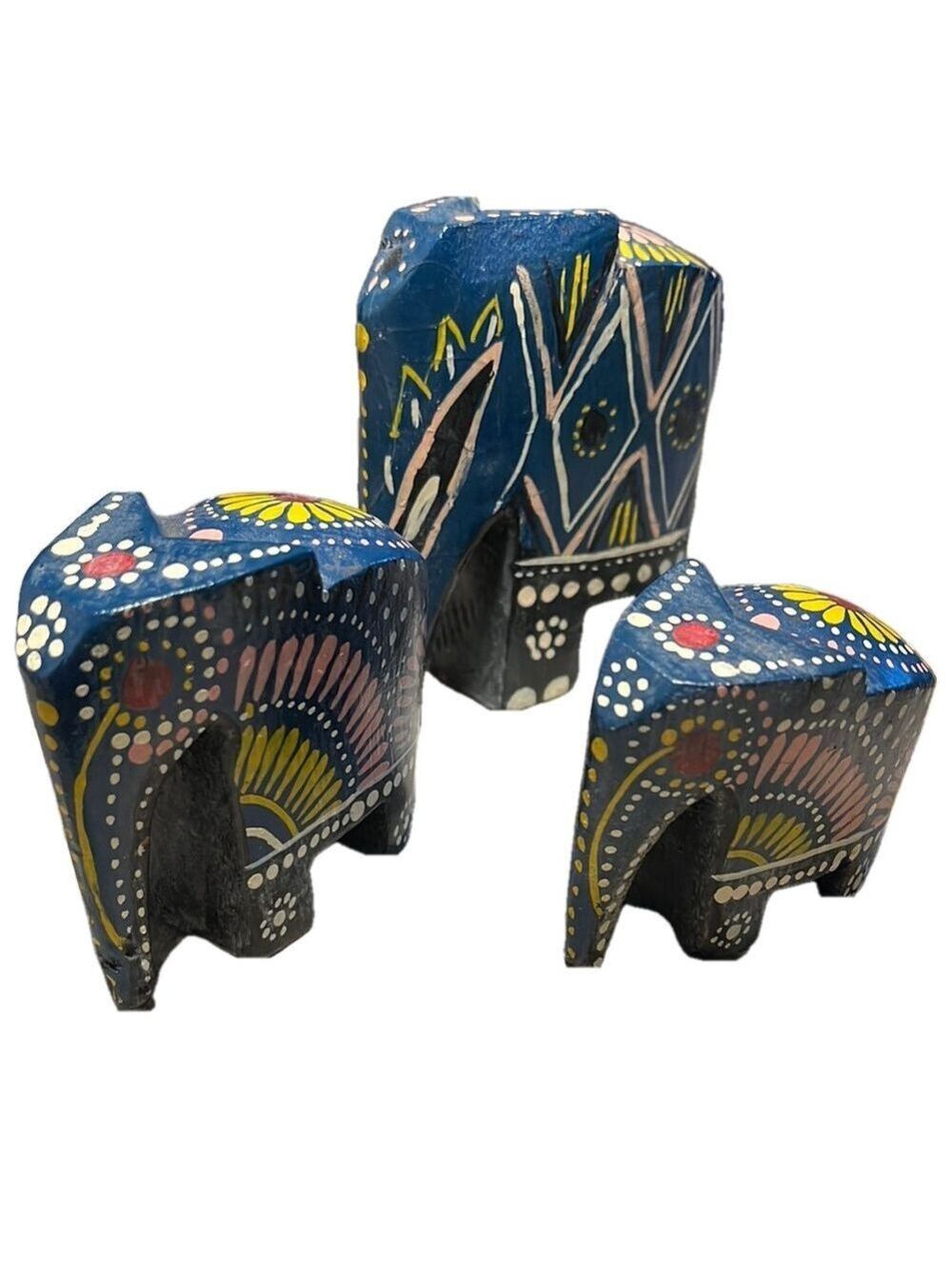 Trio of  hand painted wooden elephants